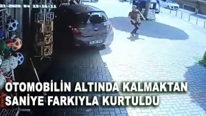 Otomobilin altında kalmaktan saniye farkıyla kurtuldu