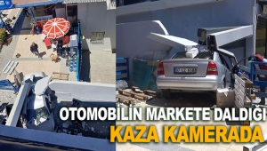 Otomobilin markete daldığı kaza kamerada