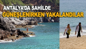 Sahilde güneşlenirken yakalandılar