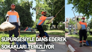 Süpürgesiyle dans ederek sokakları temizliyor