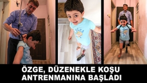 Özge, yürümeyi öğrendiği düzenekle koşu antrenmanına başladı
