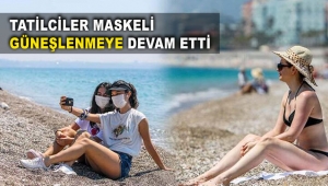 Tatilciler maskeli güneşlenmeye devam etti