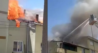 Binanın çatı katında çıkan yangın, bitişikteki binaya da sıçradı
