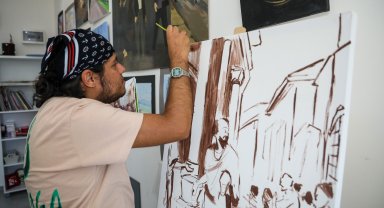 Otizmli Yiğit'in resim tutkusu tuvallerde