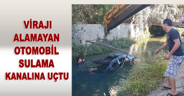 Virajı alamayan otomobil sulama kanalına uçtu